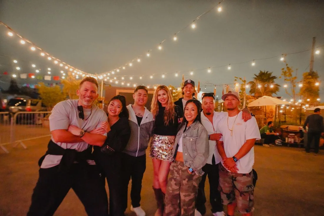 Group under the string lights at the end of the night